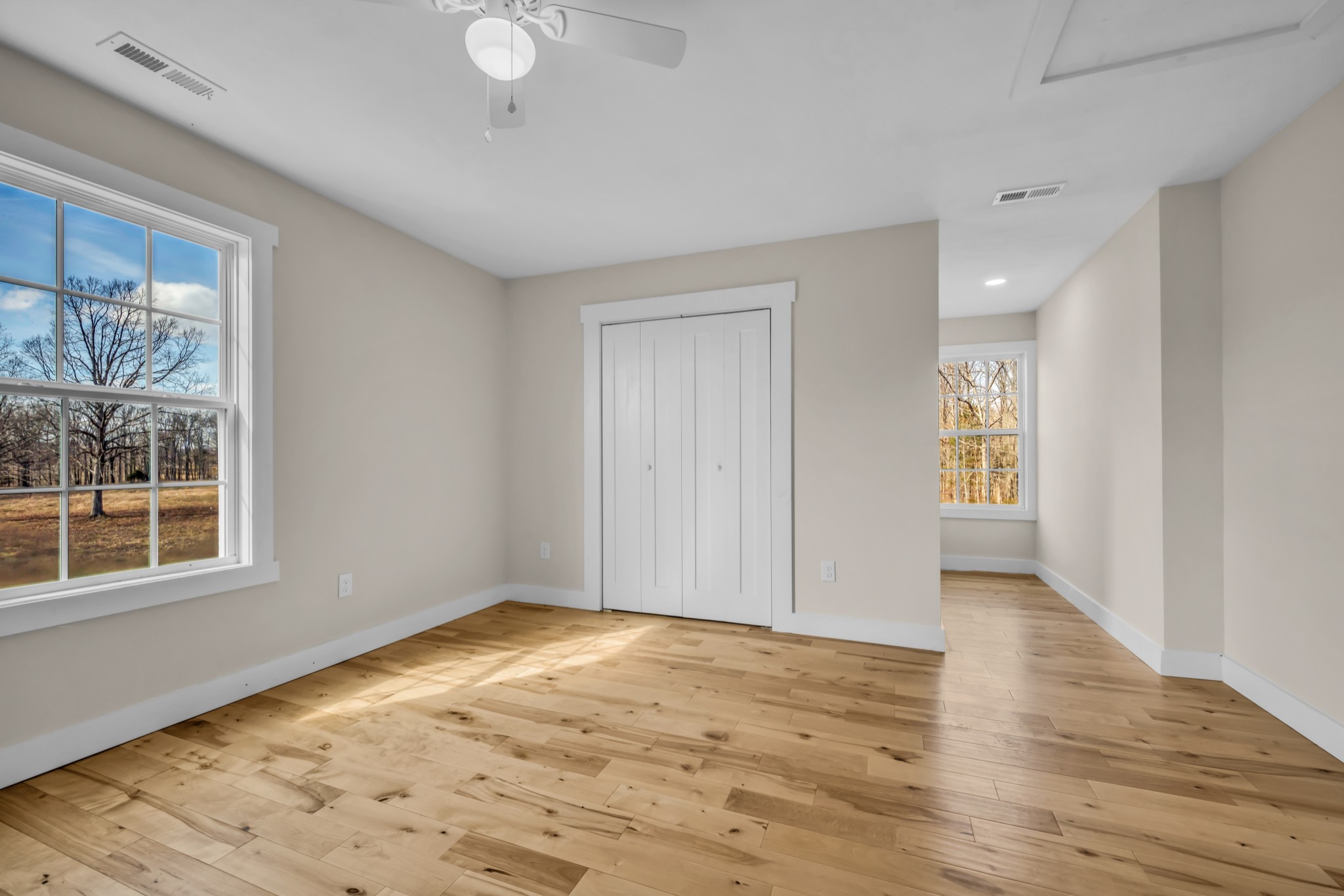 718 Darrell Rye Road Erin, TN 37061 - Photo 34 of 38 a view of an empty room with wooden floor and a window