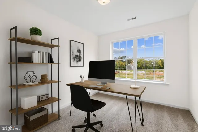 a workspace with furniture and window