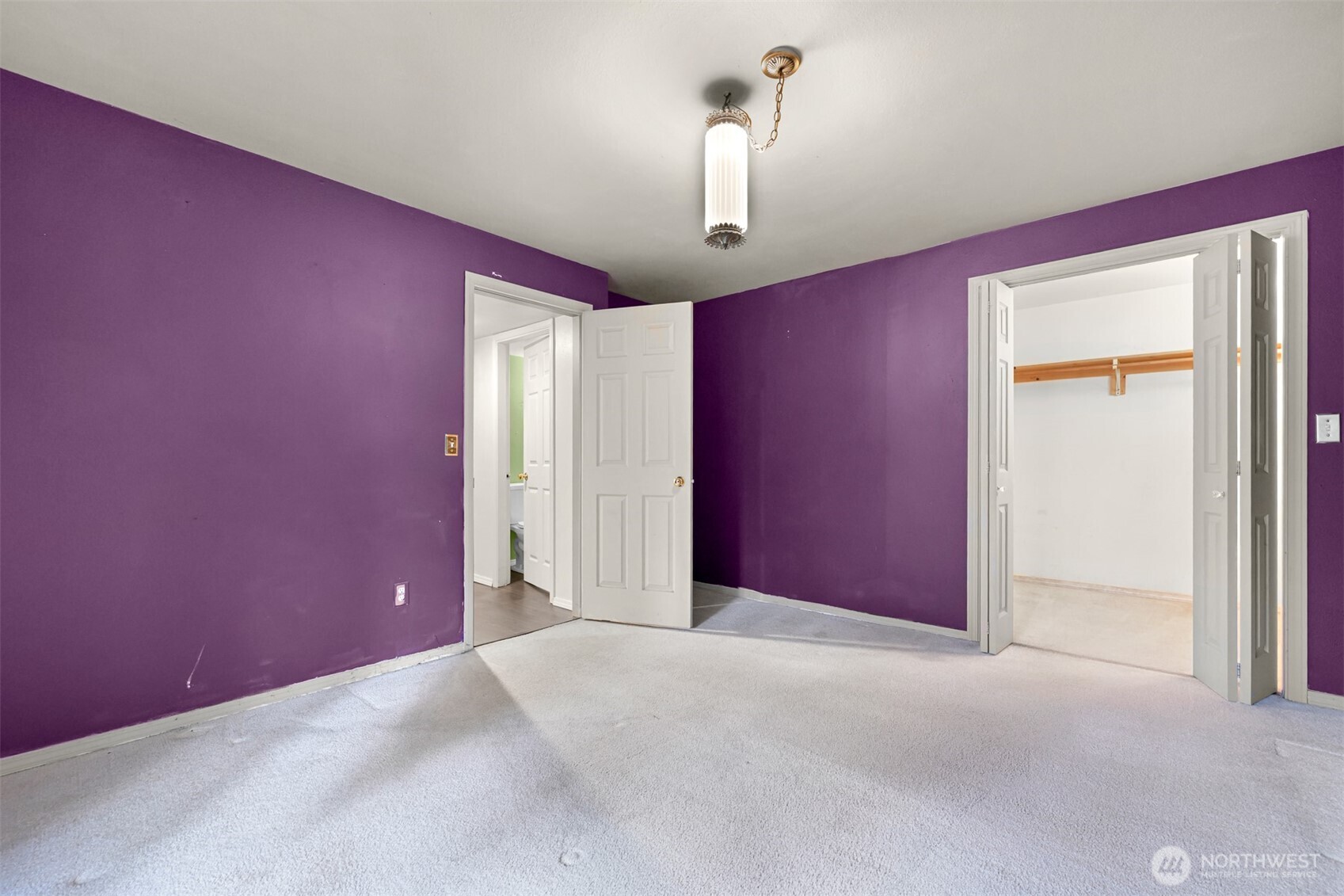 372 Sudden Valley Drive Bellingham, WA 98229 - Photo 14 of 20 a view of a livingroom with a red wall & windows