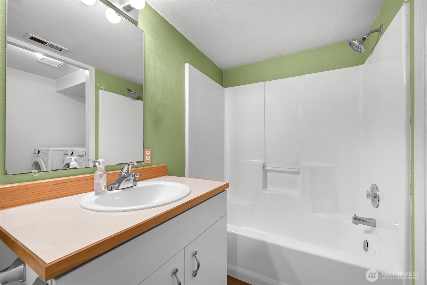 372 Sudden Valley Drive Bellingham, WA 98229 - Photo 17 of 20 a bathroom with a sink and a mirror