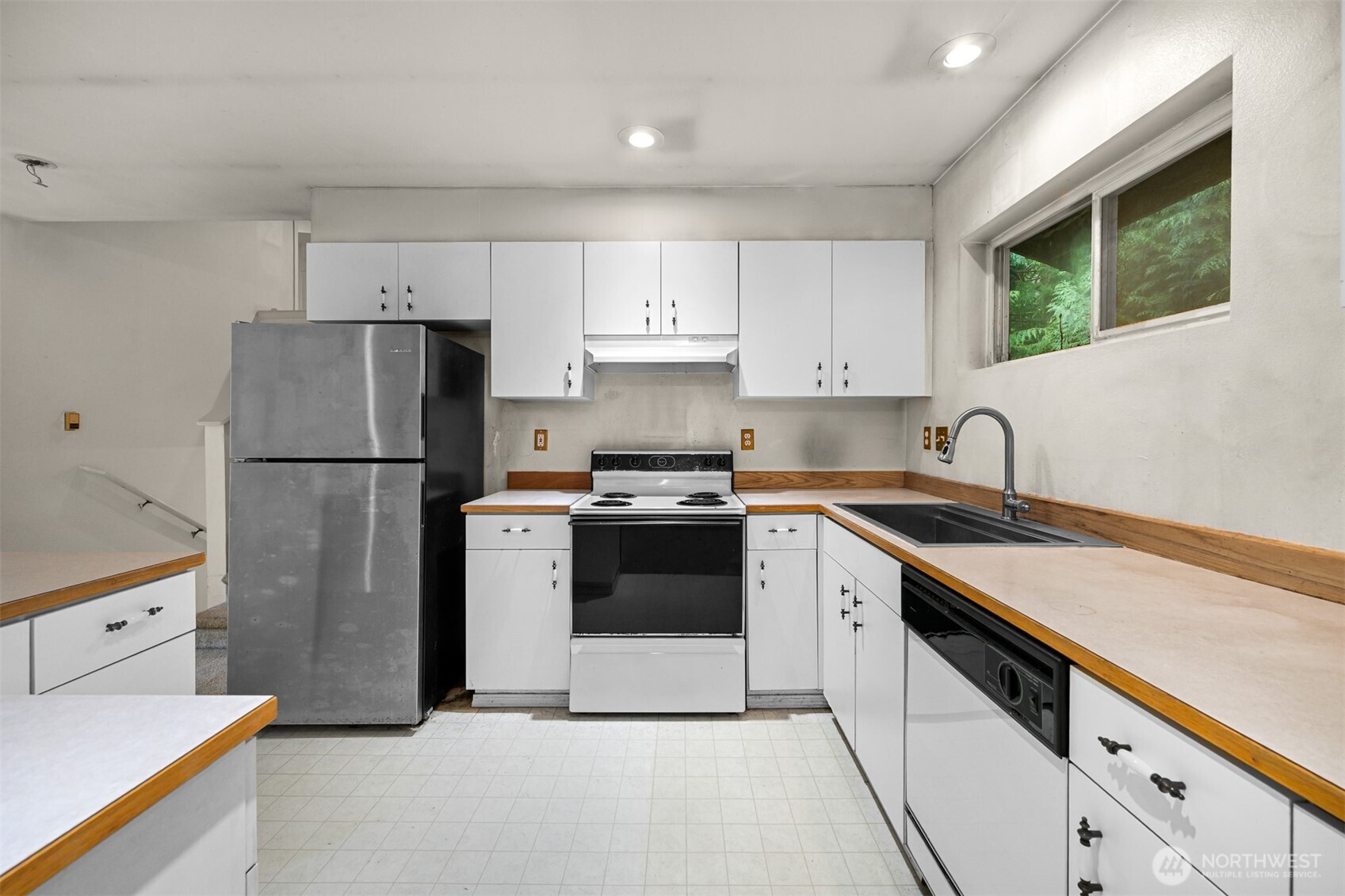 372 Sudden Valley Drive Bellingham, WA 98229 - Photo 8 of 20 a kitchen with a white cabinets and white appliances