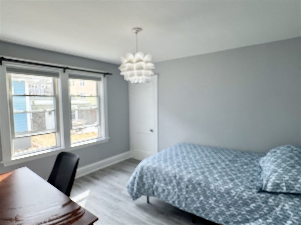 23 Drew Road, Unit 23 Belmont, MA 02478 - Photo 12 of 24 a bedroom with a bed and a window