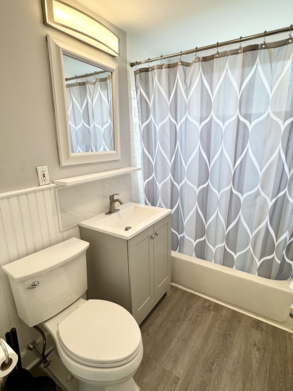 23 Drew Road, Unit 23 Belmont, MA 02478 - Photo 13 of 24 a white toilet sitting next to a bathroom sink and a shower