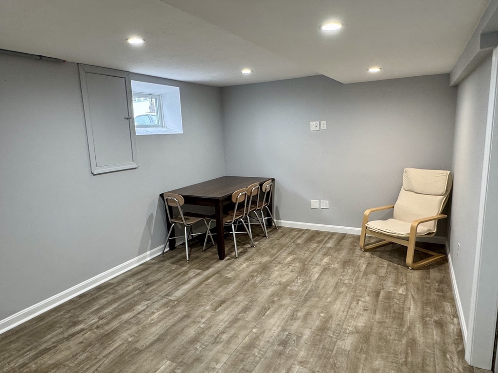 23 Drew Road, Unit 23 Belmont, MA 02478 - Photo 18 of 24 a living room with furniture and a wooden floor