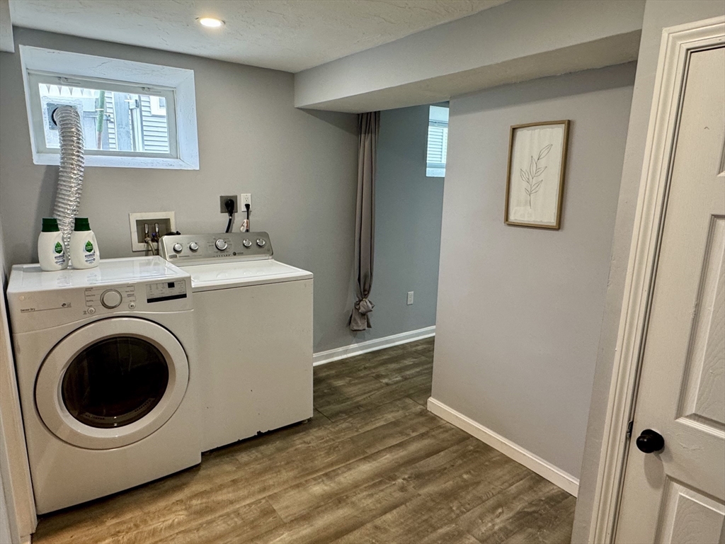 23 Drew Road, Unit 23 Belmont, MA 02478 - Photo 19 of 24 a view of a hallway with washer and dryer
