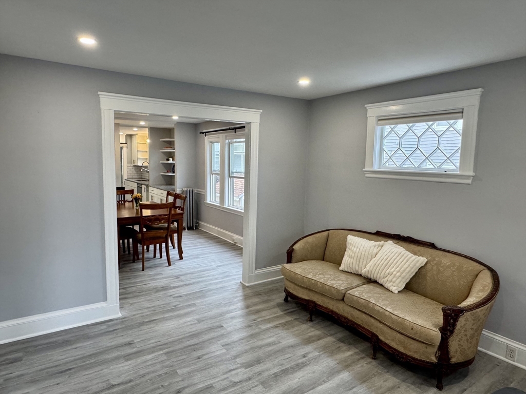 23 Drew Road, Unit 23 Belmont, MA 02478 - Photo 5 of 24 a living room with furniture and a wooden floor