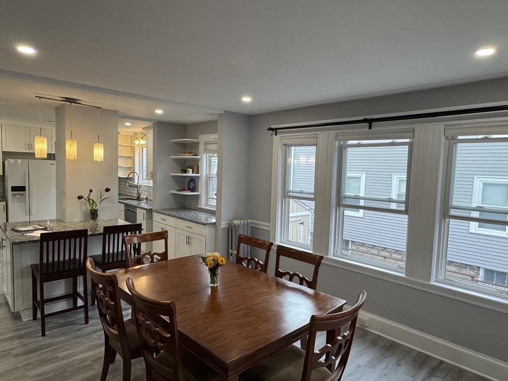 23 Drew Road, Unit 23 Belmont, MA 02478 - Photo 6 of 24 a view of a dining room with furniture window and wooden floor