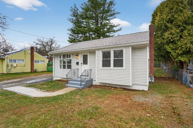 a front view of a house with a yard