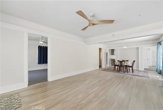 an empty room with furniture and a window