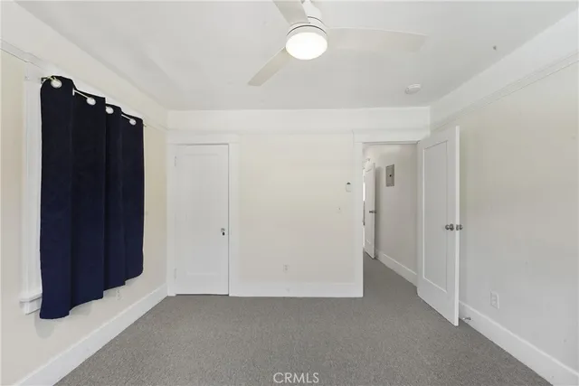 an empty room with closet area