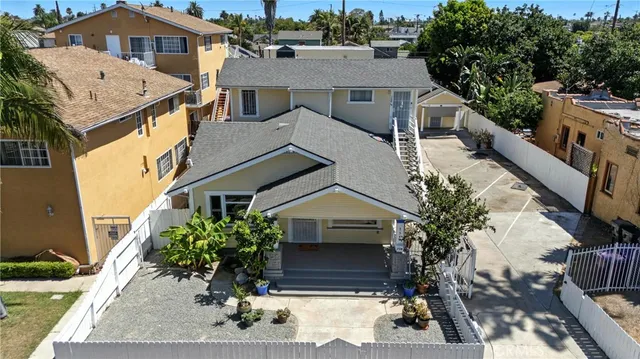 a aerial view of a house with a yard