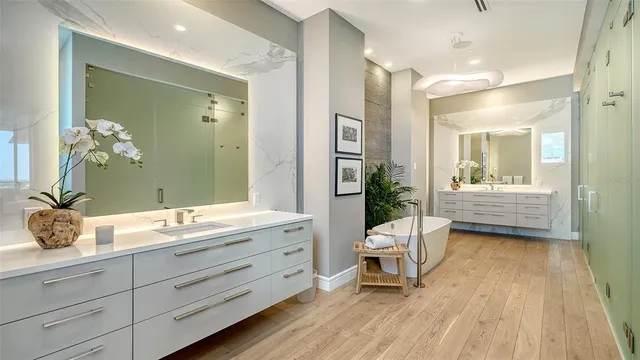 a bathroom with a double vanity sink and mirror