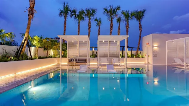 a view of swimming pool with outdoor seating
