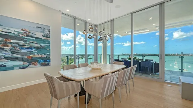 a view of a dining room with furniture window and outside view