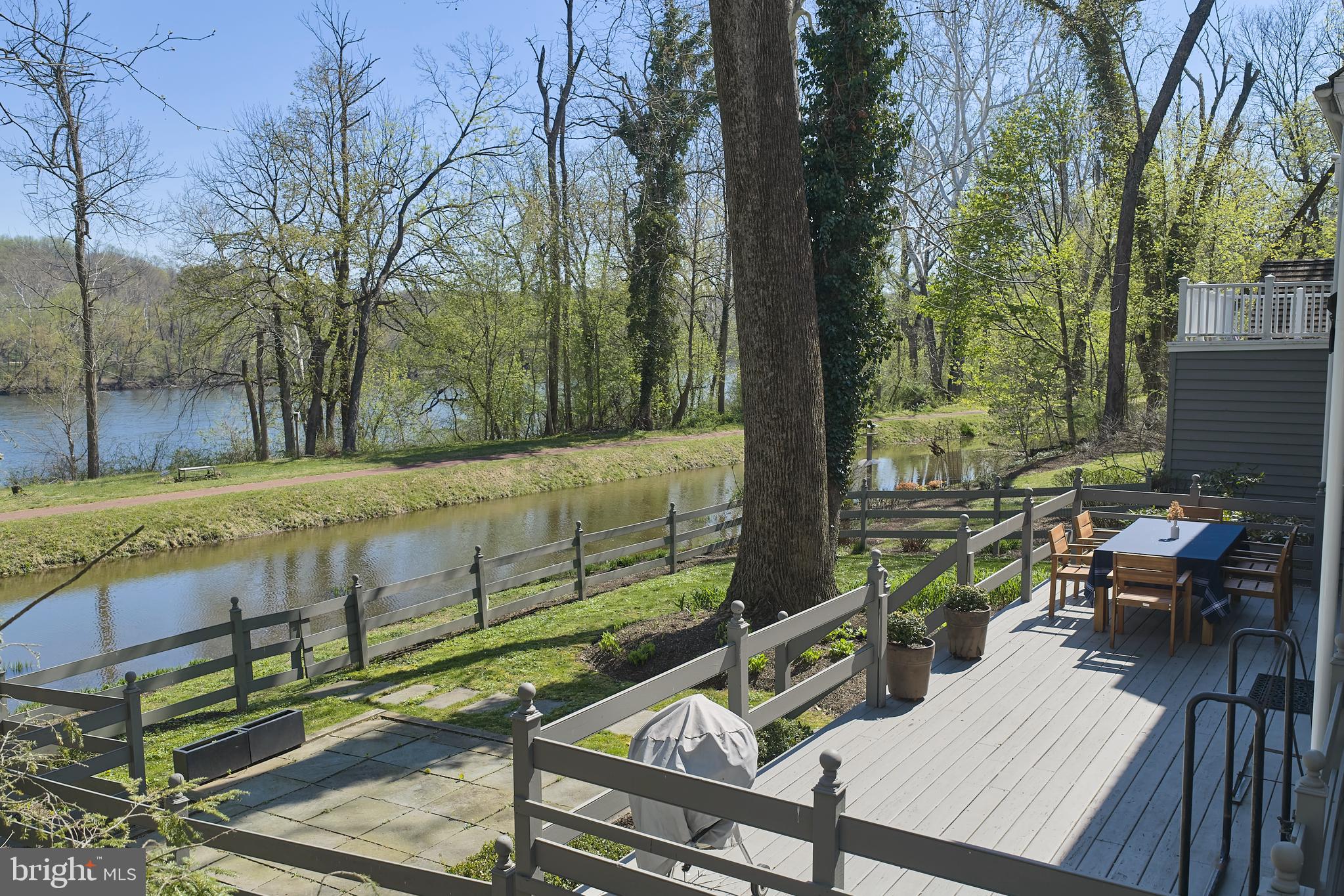 2976 River Road New Hope, PA 18938 - Photo 27 of 37 a view of a wooden deck with chairs and a tree