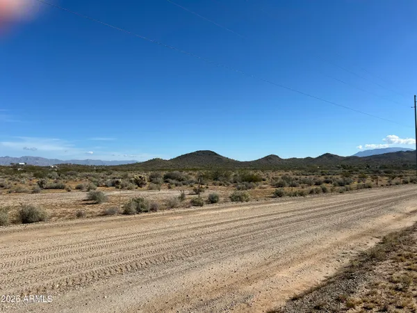 a view of an ocean and a mountain
