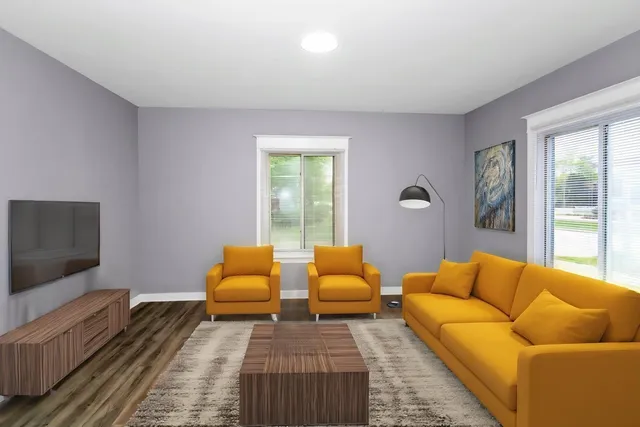 a living room with furniture and a flat screen tv