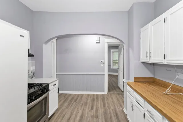 a kitchen with granite countertop a sink and a stove top oven