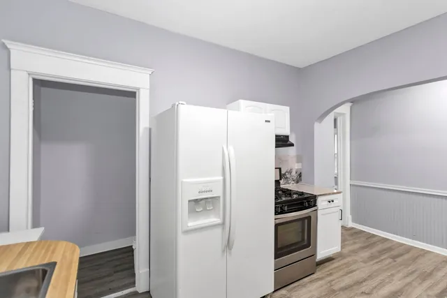 a kitchen with stainless steel appliances a refrigerator and a stove