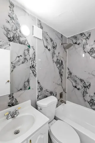 a bathroom with a sink and a bathtub