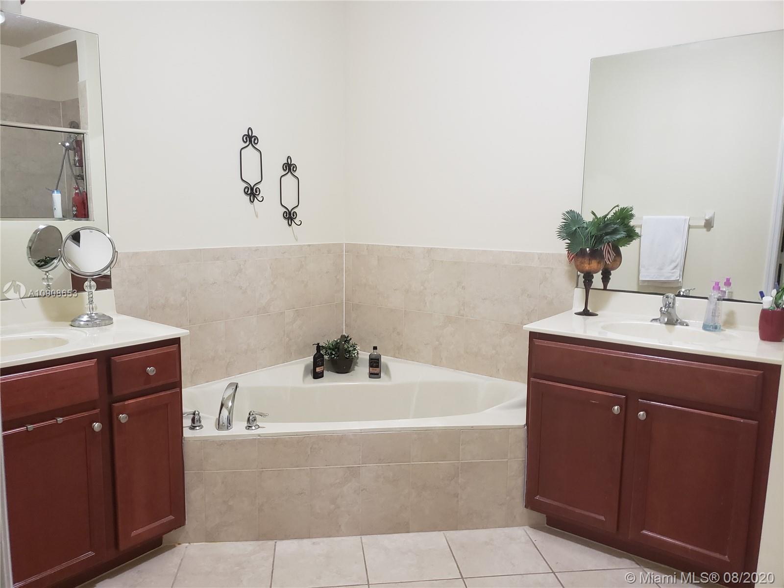 2580 Southwest 147 Path Miami, FL 33185 - Photo 3 of 11 a bathroom with a bathtub and sink