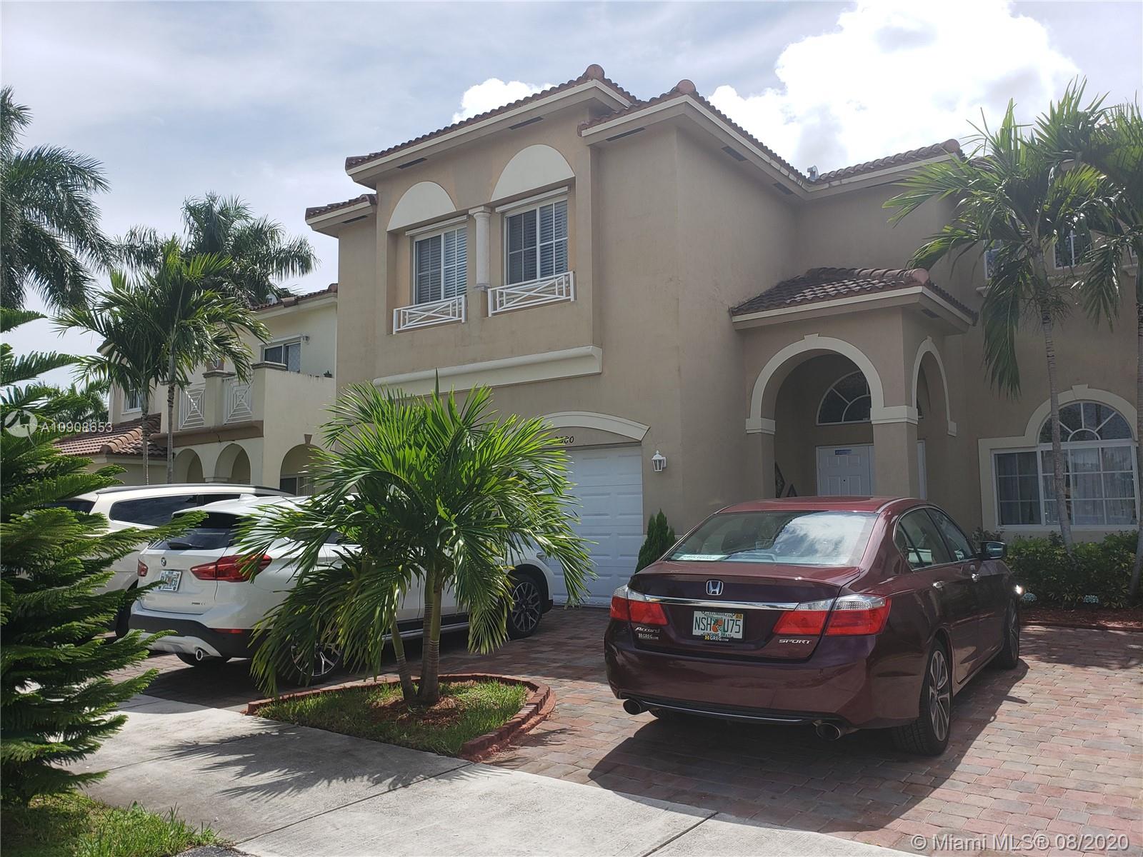 2580 Southwest 147 Path Miami, FL 33185 - Photo 4 of 11 a front view of a house with cars