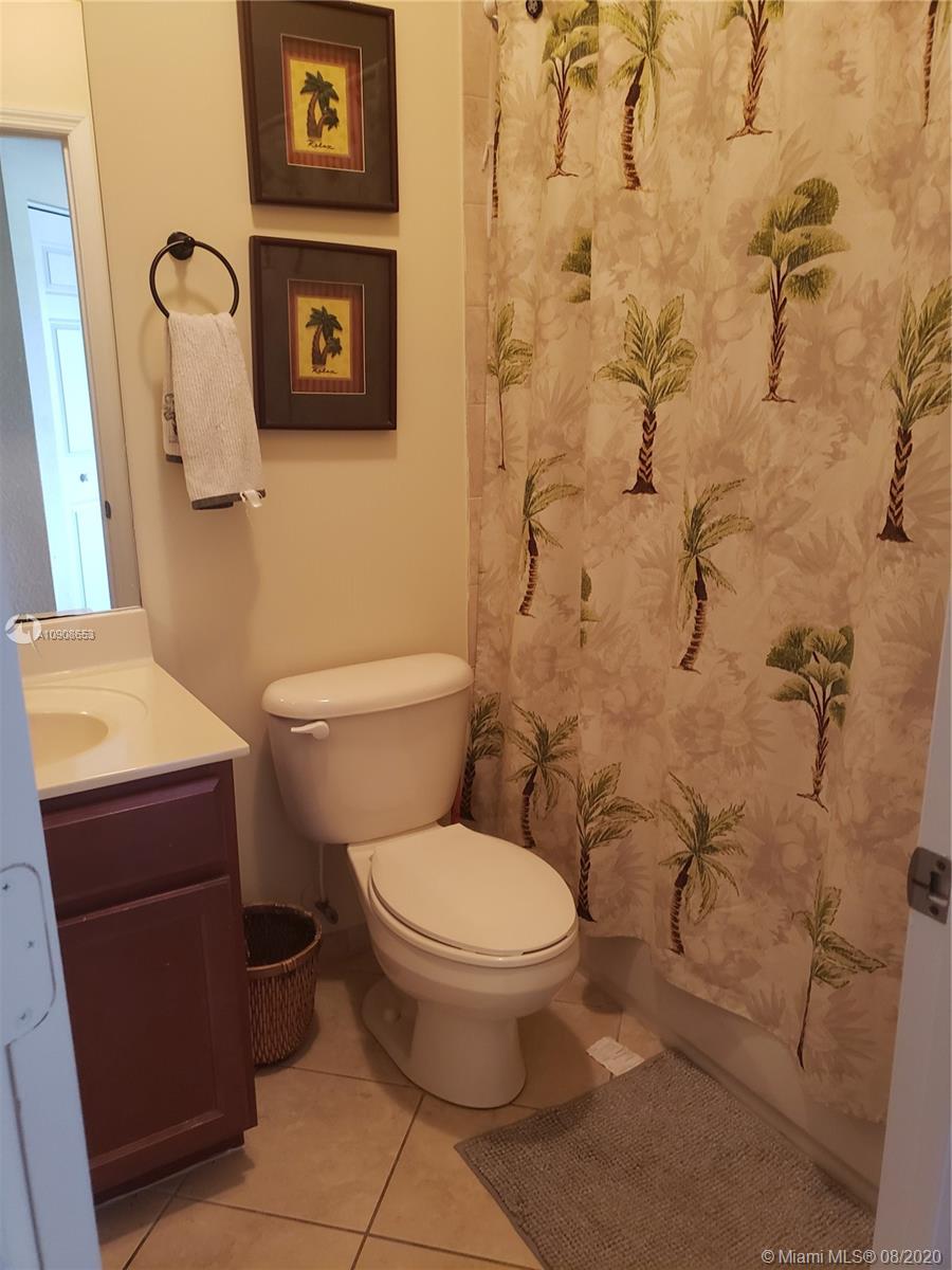 2580 Southwest 147 Path Miami, FL 33185 - Photo 5 of 11 a white toilet sitting next to a bathroom sink