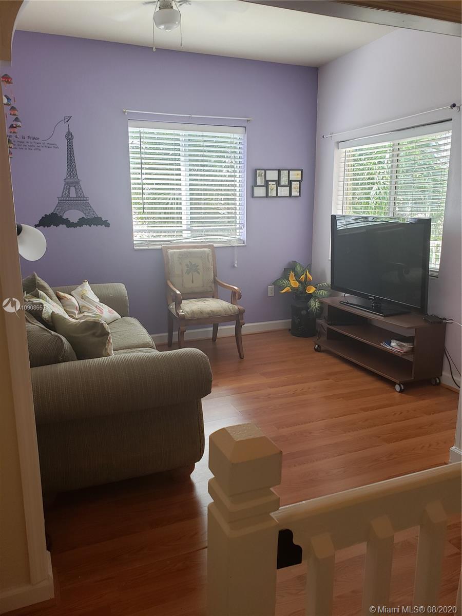 2580 Southwest 147 Path Miami, FL 33185 - Photo 7 of 11 a living room with furniture and a flat screen tv