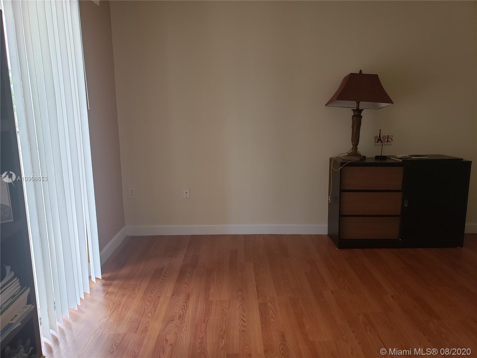 2580 Southwest 147 Path Miami, FL 33185 - Photo 8 of 11 a living room with wooden floor