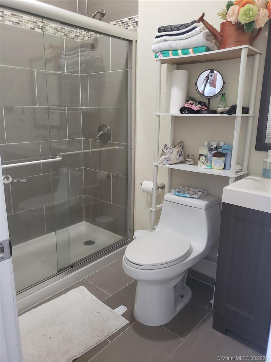 2580 Southwest 147 Path Miami, FL 33185 - Photo 9 of 11 a bathroom with a toilet and a shower