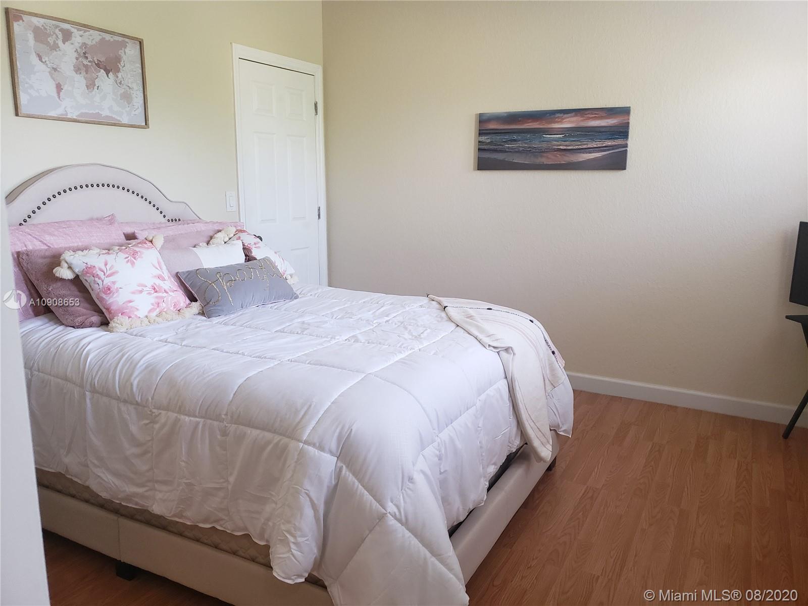 2580 Southwest 147 Path Miami, FL 33185 - Photo 10 of 11 a bedroom with a bed and a wall painting