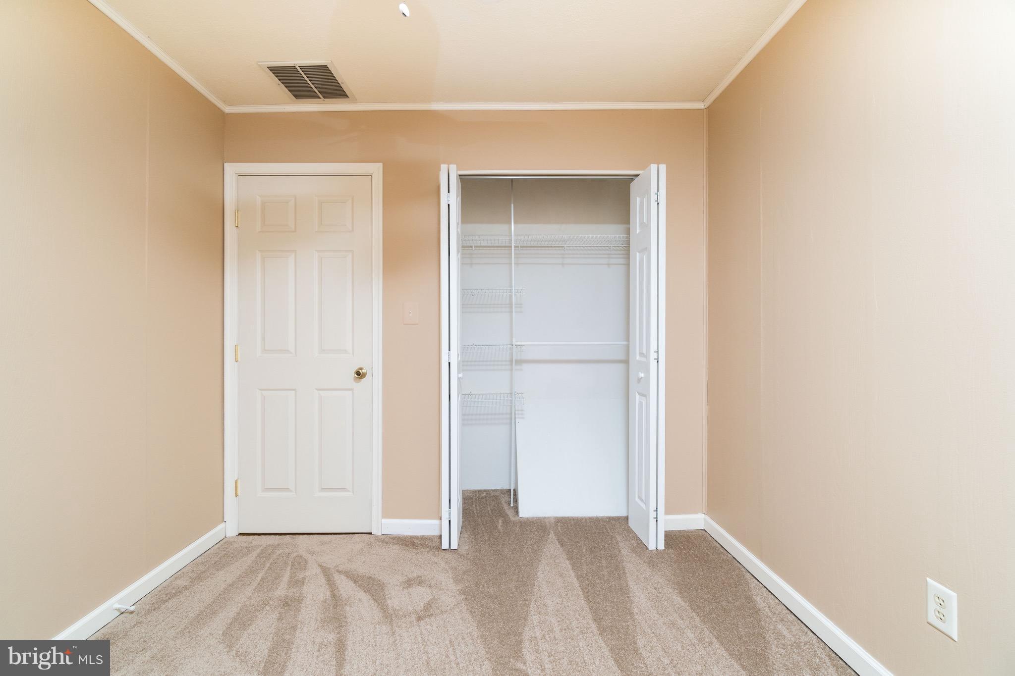 2001 Shore Road Baltimore, MD 21222 - Photo 14 of 27 a view of an empty room with closet and a window