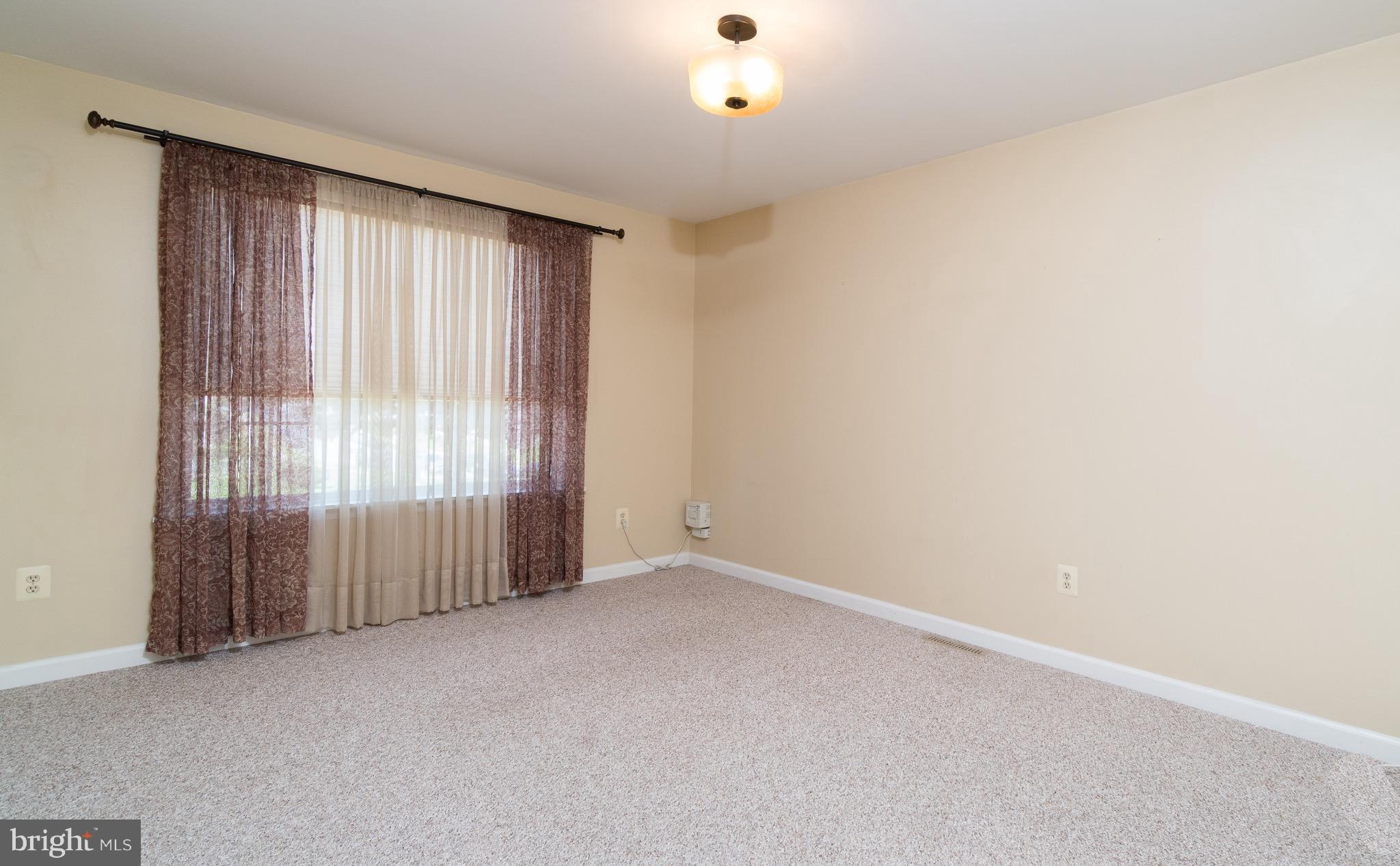 2001 Shore Road Baltimore, MD 21222 - Photo 3 of 27 an empty room with windows