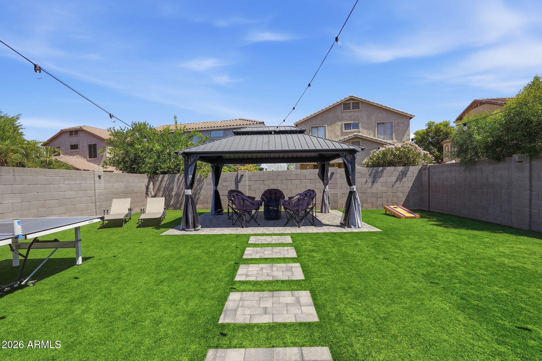 4184 East Trigger Way Gilbert, AZ 85297 - Photo 35 of 51 a front view of a house with a yard