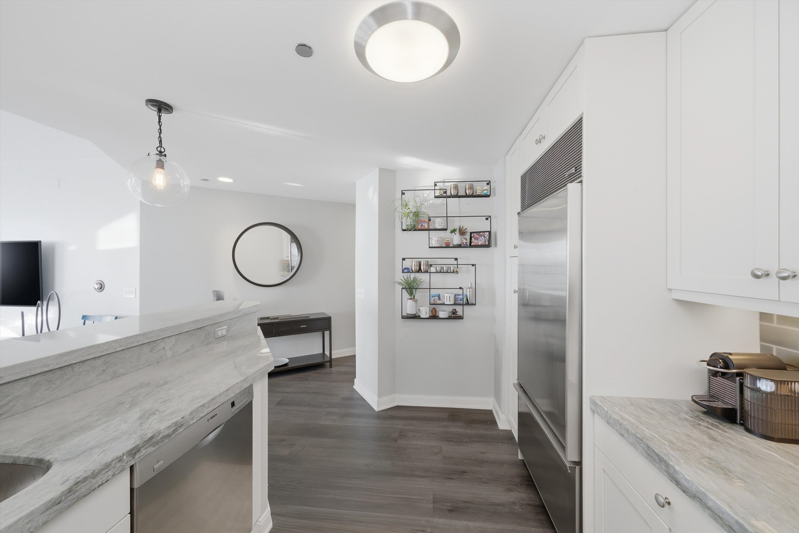 60 East Monroe Street, Unit 5304 Chicago, IL 60603 - Photo 13 of 55 a kitchen with cabinets and window