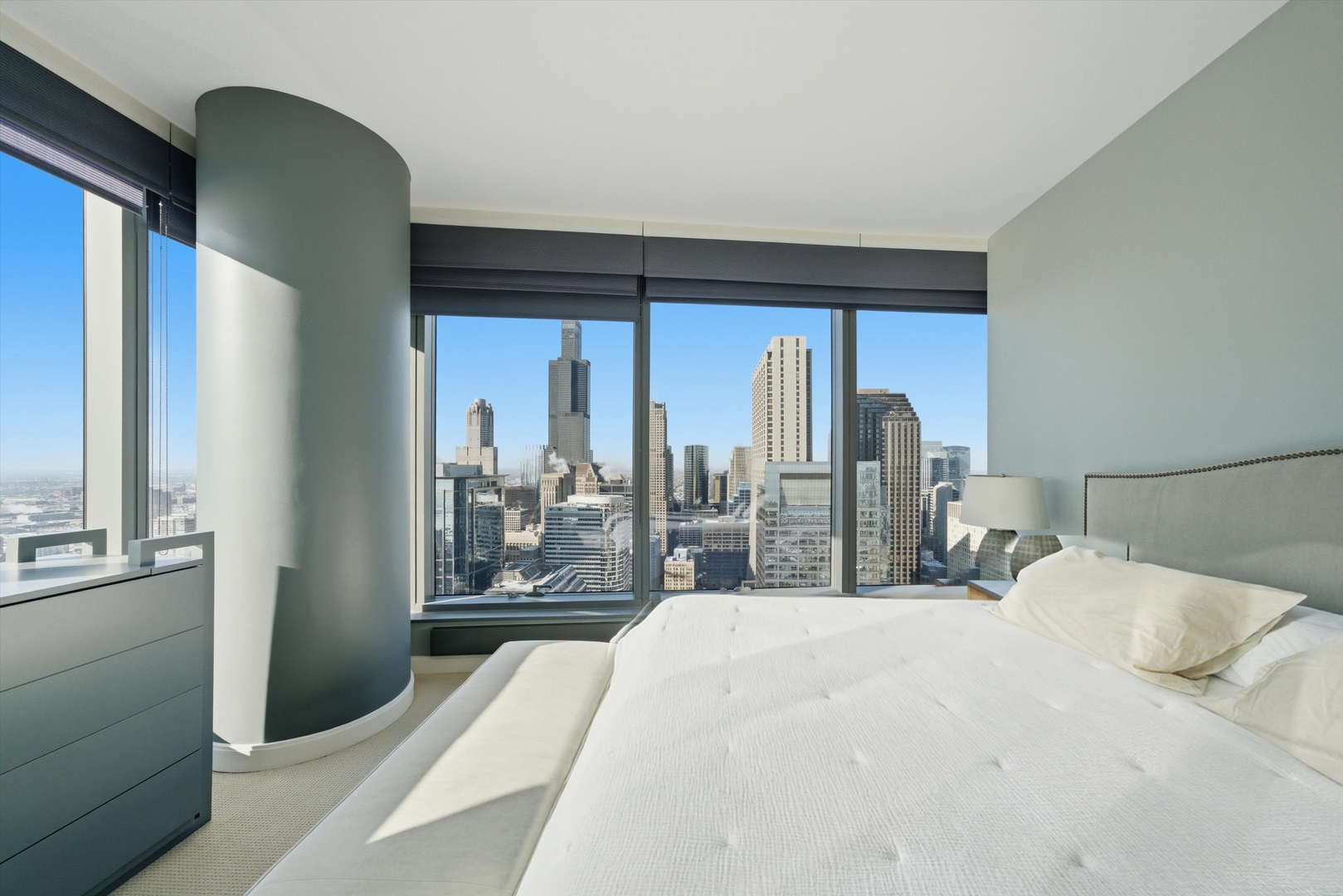60 East Monroe Street, Unit 5304 Chicago, IL 60603 - Photo 18 of 55 a bedroom with a large bed and a balcony view