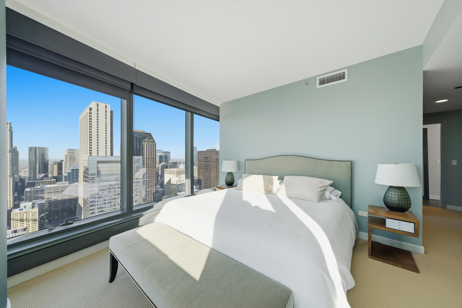 60 East Monroe Street, Unit 5304 Chicago, IL 60603 - Photo 20 of 55 a bedroom with a large bed and a large window