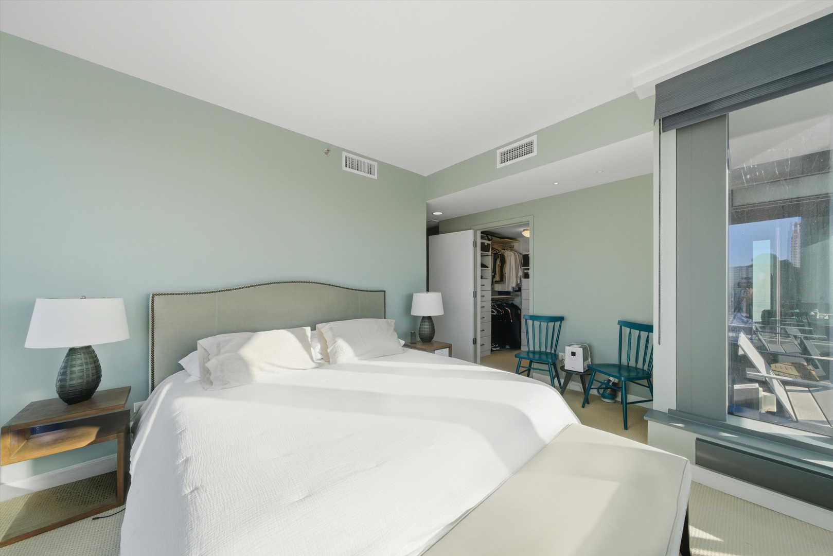 60 East Monroe Street, Unit 5304 Chicago, IL 60603 - Photo 21 of 55 a bedroom with a bed and a large mirror