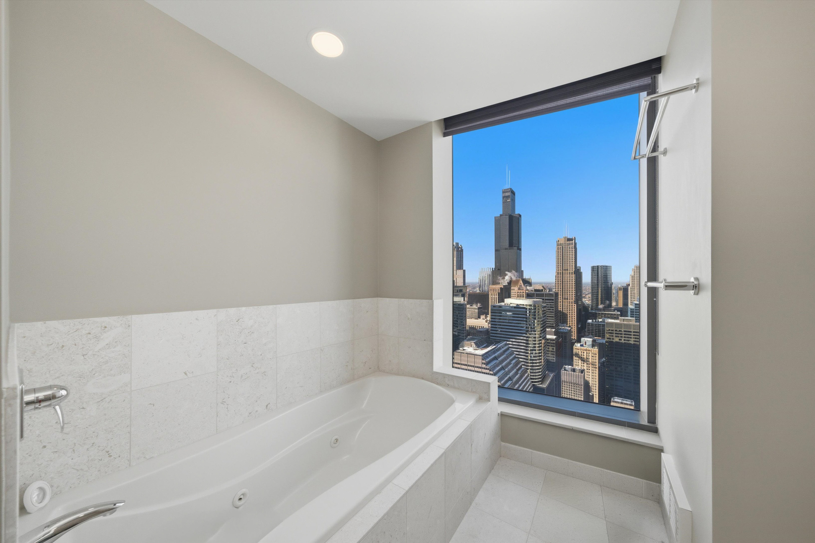 60 East Monroe Street, Unit 5304 Chicago, IL 60603 - Photo 26 of 55 a bathroom with a bathtub and a shower