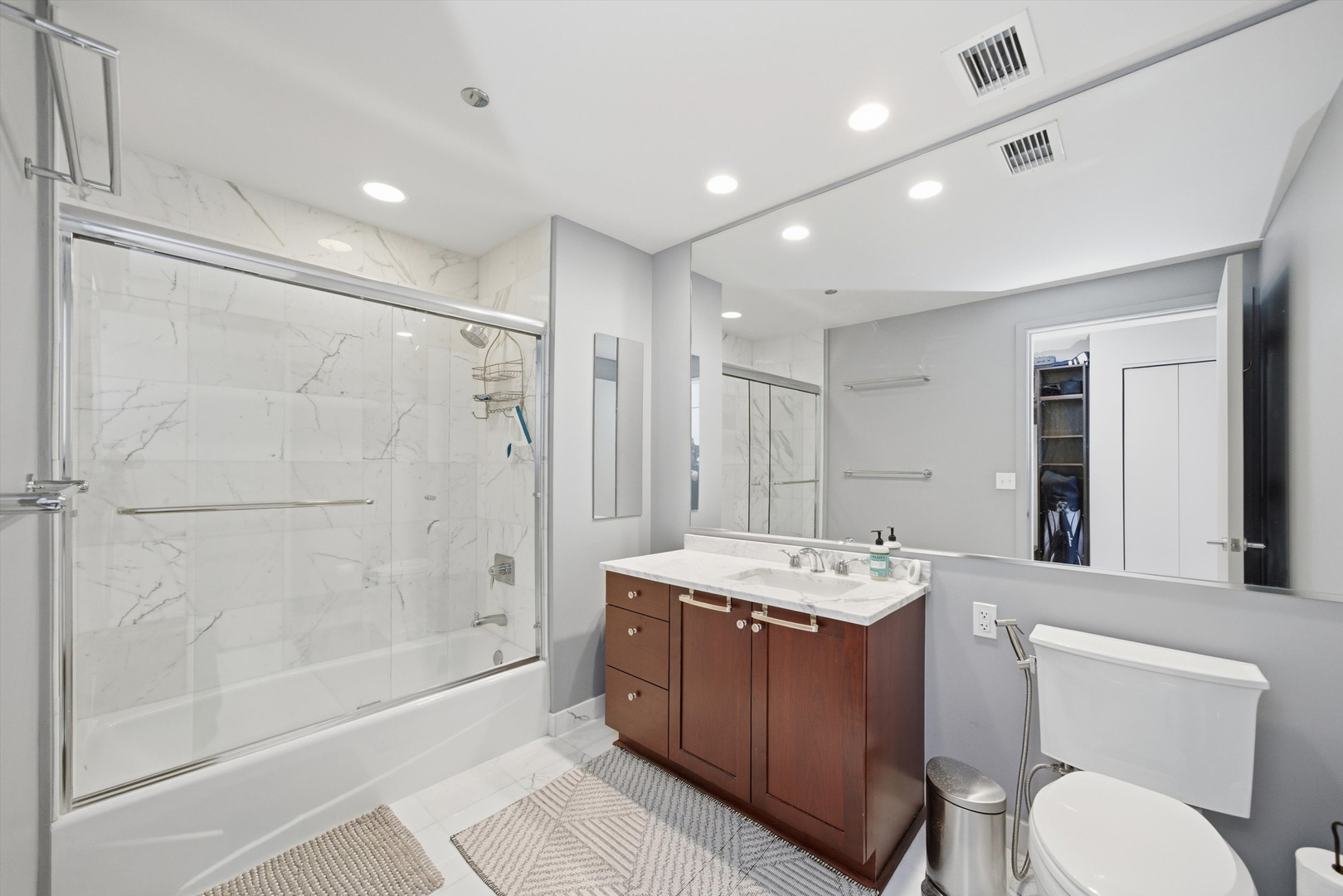 60 East Monroe Street, Unit 5304 Chicago, IL 60603 - Photo 32 of 55 a bathroom with a sink toilet tub and shower