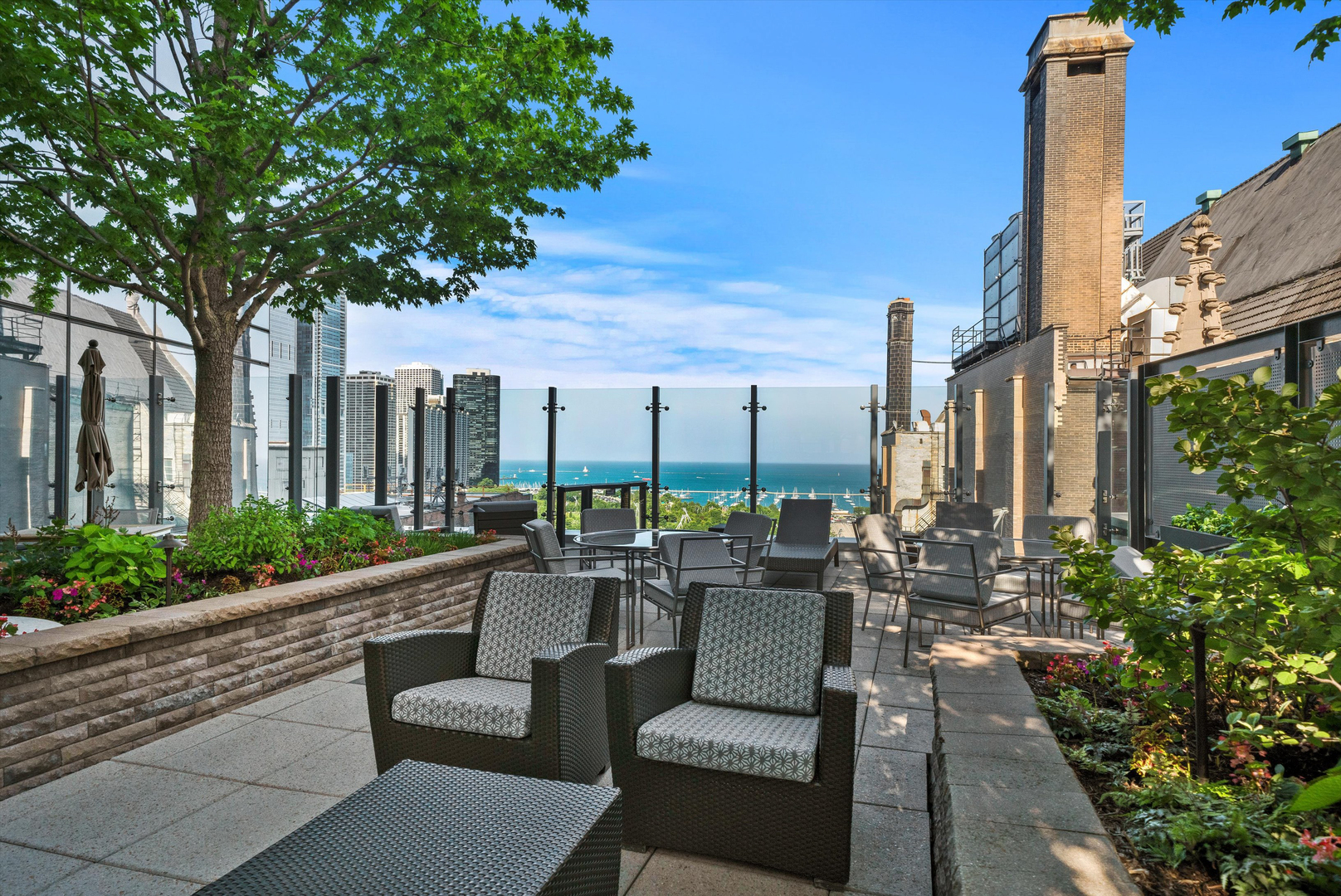 60 East Monroe Street, Unit 5304 Chicago, IL 60603 - Photo 39 of 55 a building outdoor space with patio furniture and potted plants