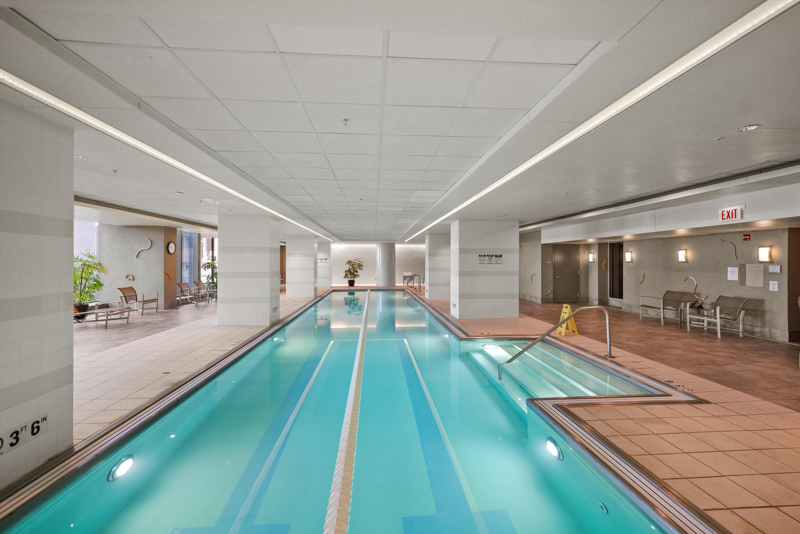 60 East Monroe Street, Unit 5304 Chicago, IL 60603 - Photo 44 of 55 a swimming pool with lounge chair