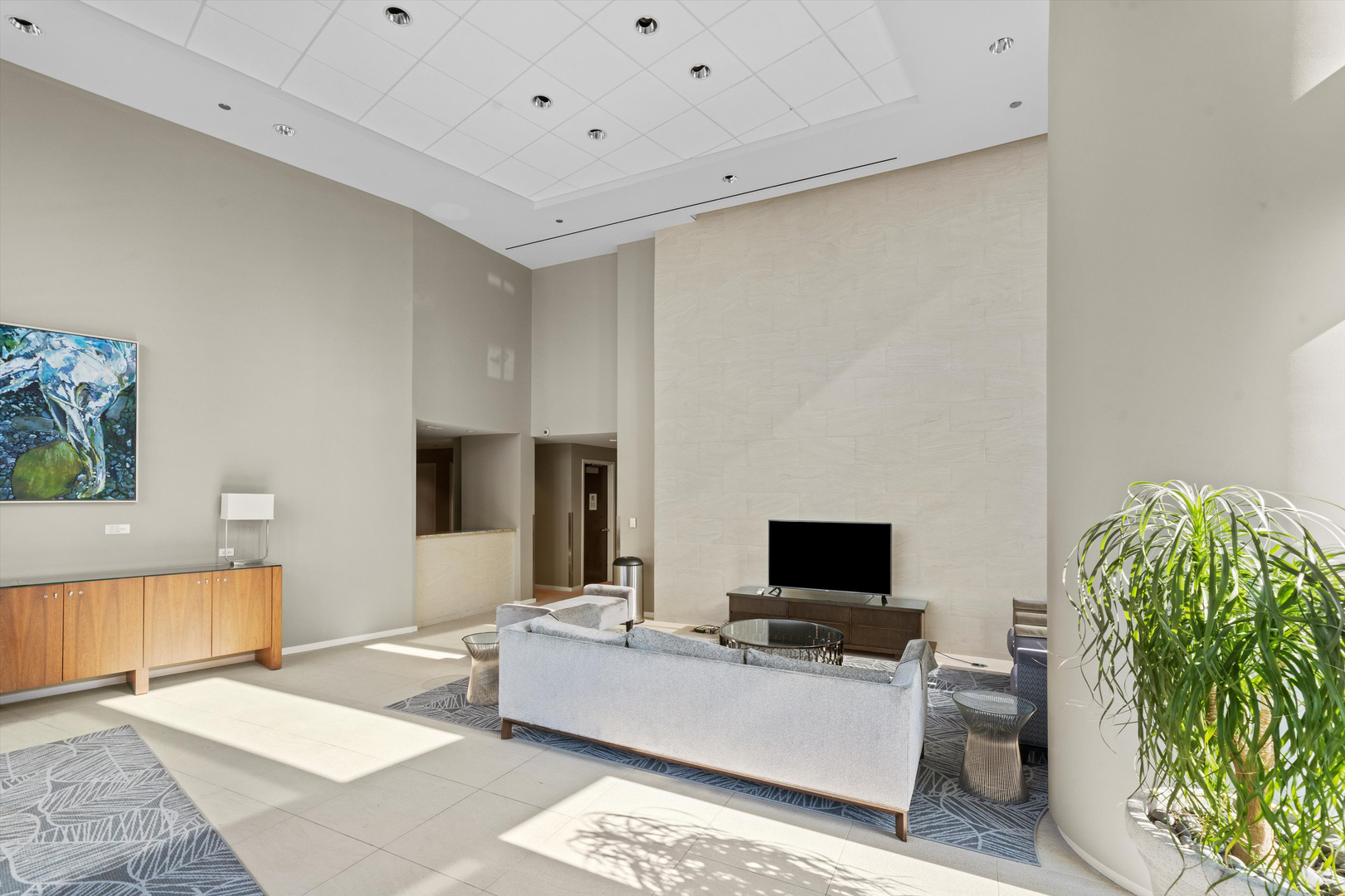 60 East Monroe Street, Unit 5304 Chicago, IL 60603 - Photo 50 of 55 a living room with furniture and a flat screen tv