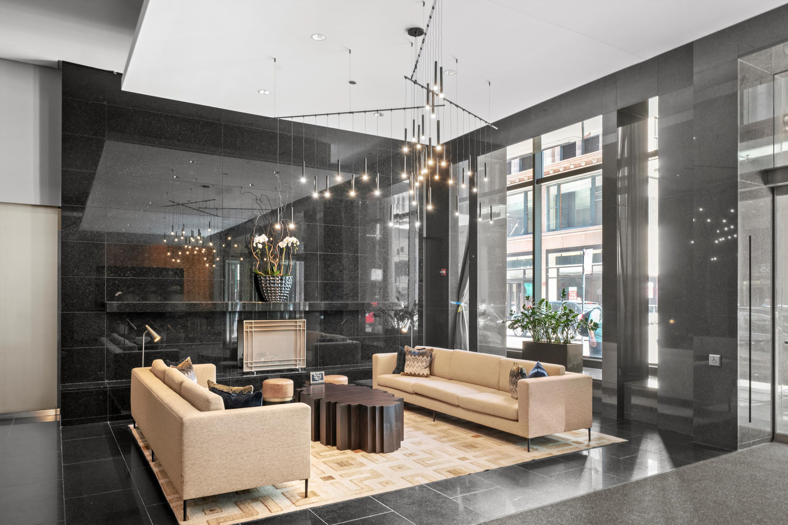 60 East Monroe Street, Unit 5304 Chicago, IL 60603 - Photo 51 of 55 a living room with furniture and a chandelier