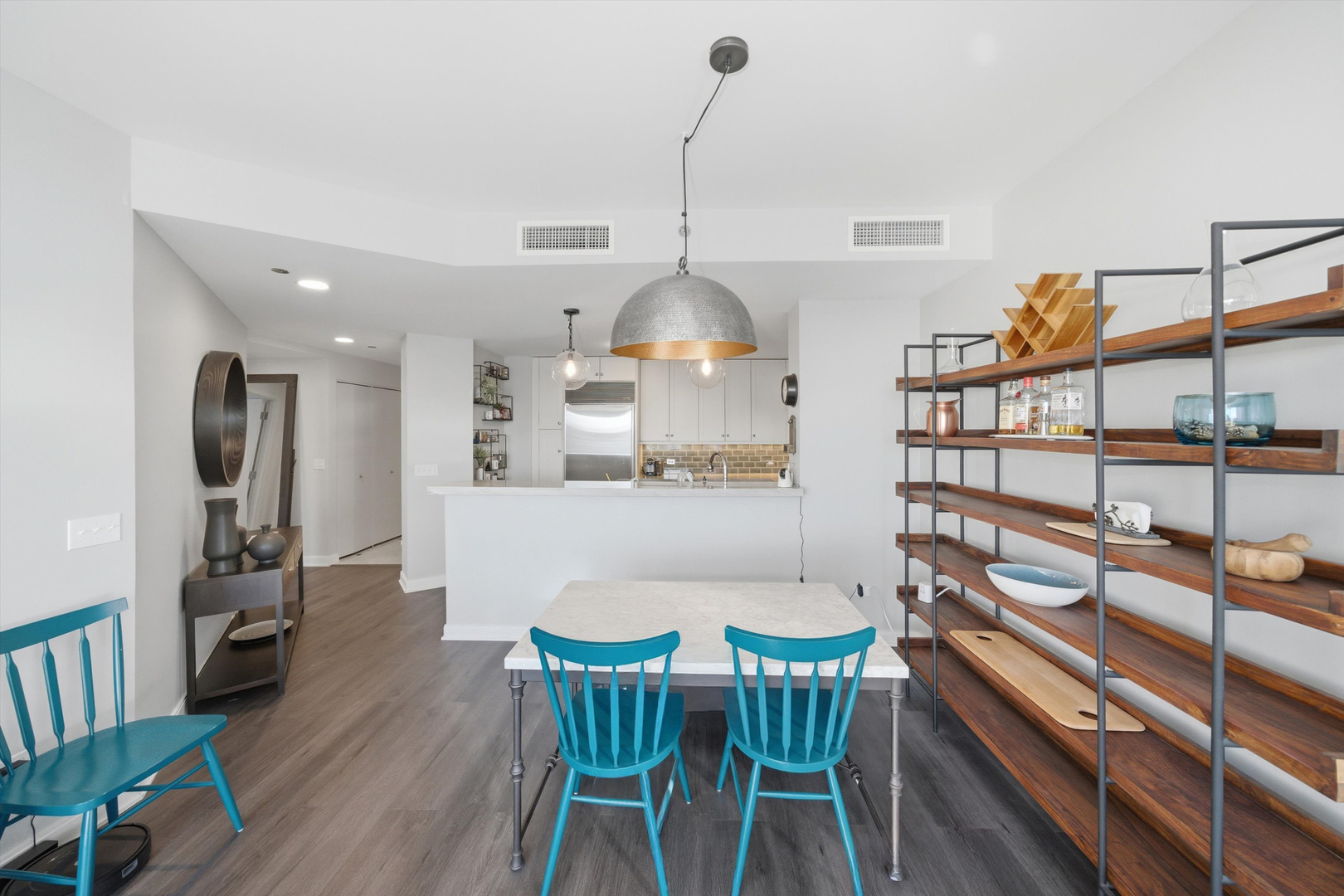 60 East Monroe Street, Unit 5304 Chicago, IL 60603 - Photo 7 of 55 a view of a dining room with furniture and wooden floor