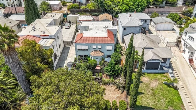 an aerial view of residential house with an outdoor space