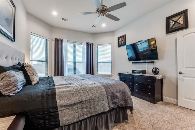 a kitchen with kitchen island a counter top space stainless steel appliances and cabinets
