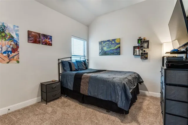 a bathroom with a granite countertop sink a toilet and a mirror