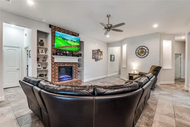 a spacious en suite bathroom with a double vanity and mirrors