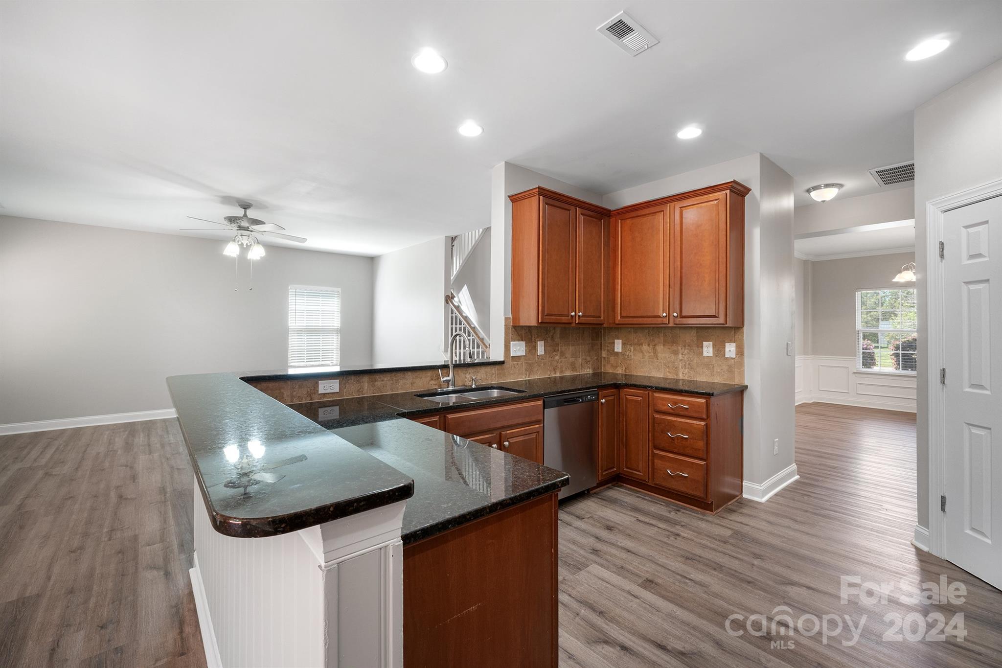 4009 Thorndale Road Indian Trail, NC 28079 - Photo 13 of 48 a kitchen with granite countertop a sink and cabinets